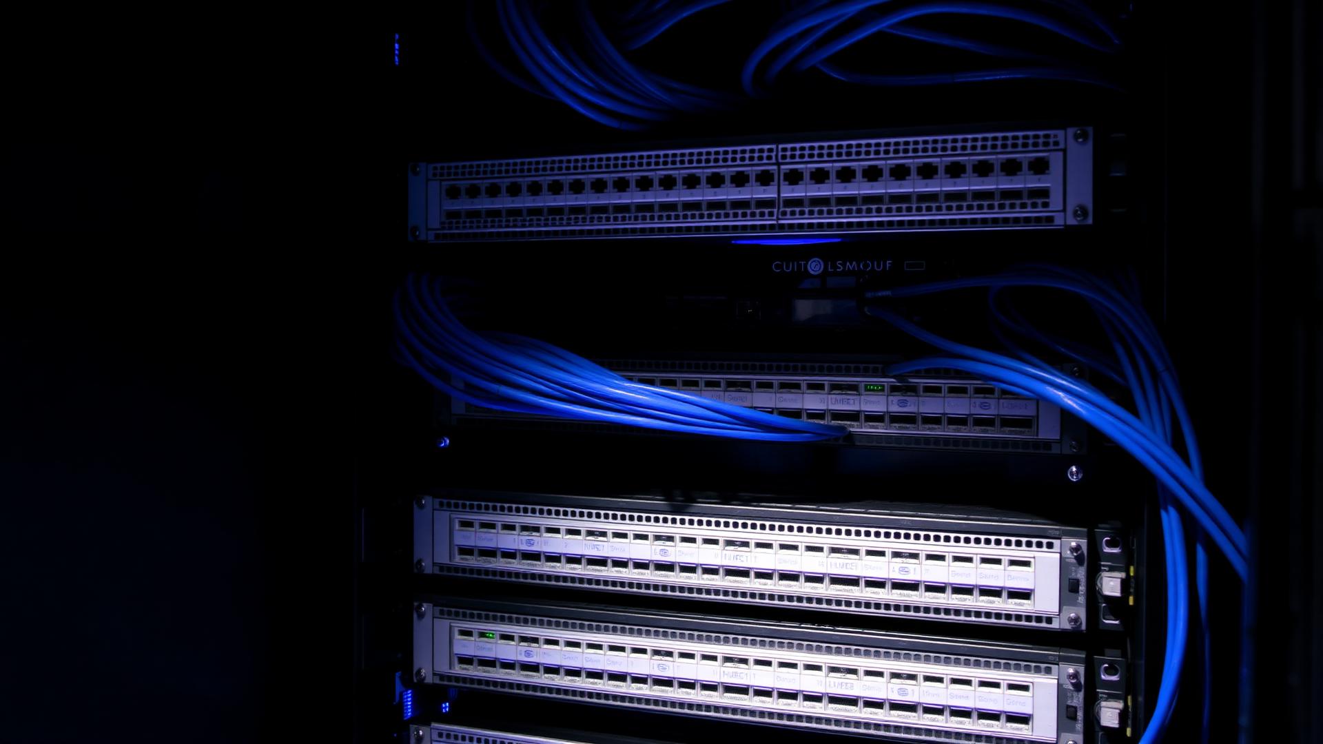 Professionally installed network cabinet with UniFi equipment, fibre and labelled cabling